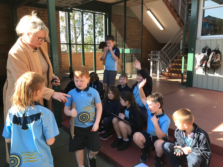 Students ouside with teacher learning about maths